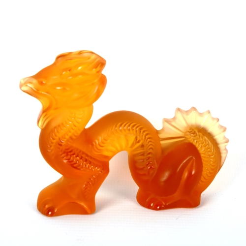 1228 - LALIQUE - an orange glass dragon, engraved signature, length 9.5cm