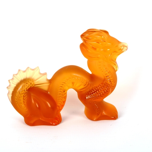 1228 - LALIQUE - an orange glass dragon, engraved signature, length 9.5cm