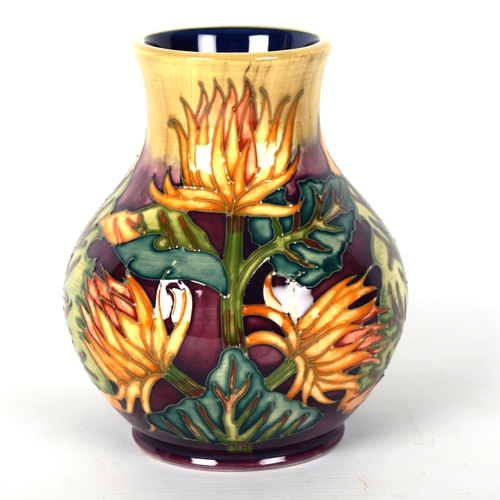 1234 - MOORCROFT POTTERY - a vase with exotic flower design 1999, height 15.5cm