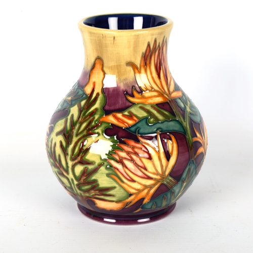 1234 - MOORCROFT POTTERY - a vase with exotic flower design 1999, height 15.5cm