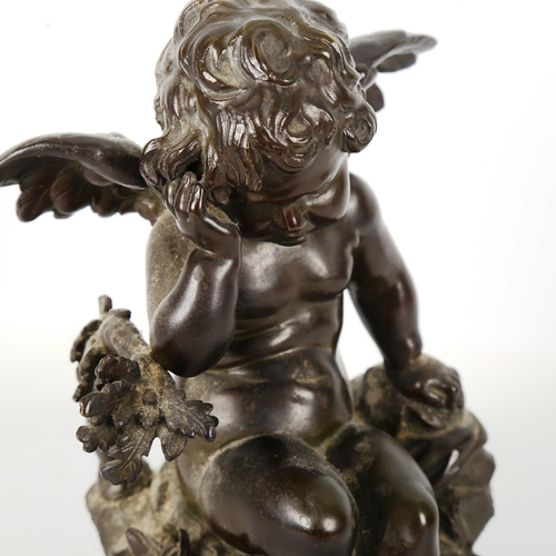 1261 - AUGUSTE MOREAU (1834 - 1917) - a 19th century patinated bronze sculpture, Cupid sitting on a rock, s... 