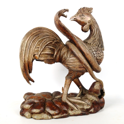 1262 - A carved and painted wood sculpture of a cobra and cockerel, height 43cm