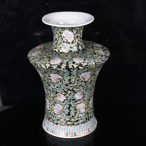 1275 - A Chinese porcelain vase, with painted flowers on black ground, height 30cm, base drilled, 6 charact... 