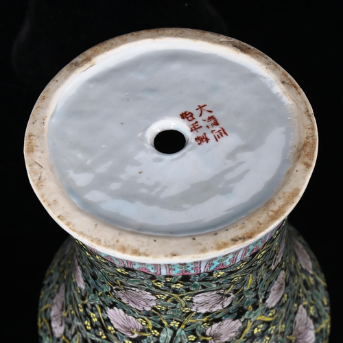 1275 - A Chinese porcelain vase, with painted flowers on black ground, height 30cm, base drilled, 6 charact... 