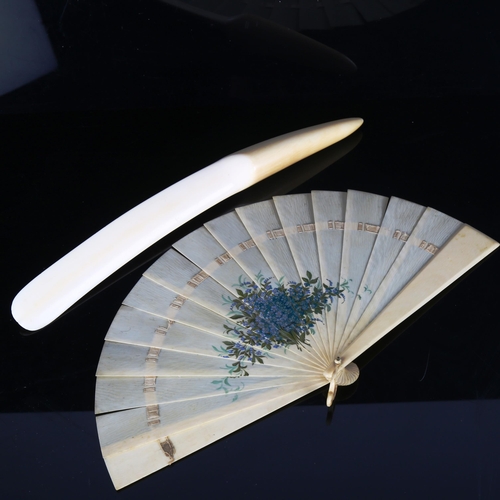 1289 - A French ivory fan with painted floral spray, length 19cm, and an ivory page turner, length 35cm (2)