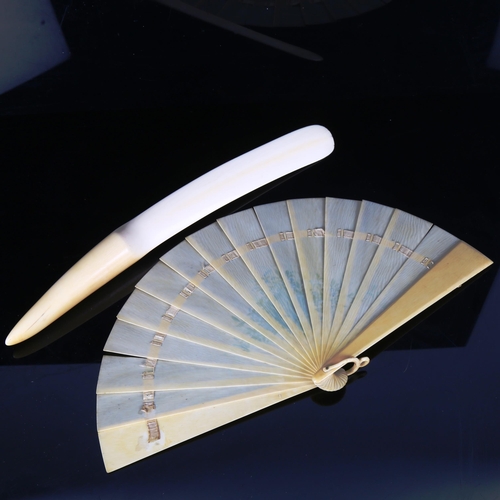 1289 - A French ivory fan with painted floral spray, length 19cm, and an ivory page turner, length 35cm (2)