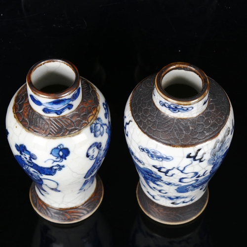 1291 - A pair of Chinese blue and white crackle glaze vases, height 16.5cm