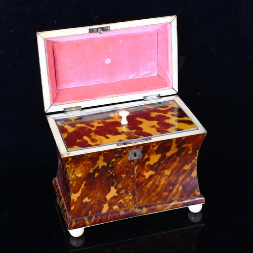 1295 - A 19th century tortoiseshell sarcophagus-shaped tea caddy, with ring handle, ivory ball feet and inn... 