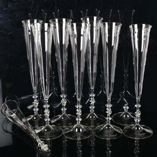 1297 - A set of 8 Venetian handmade glass Champagne flutes, height 33cm (1 A/F)