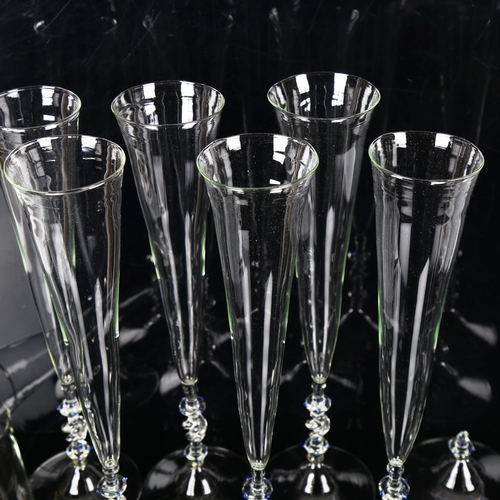 1297 - A set of 8 Venetian handmade glass Champagne flutes, height 33cm (1 A/F)