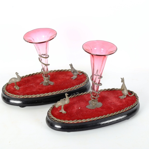 1301 - A pair of 19th century Australian epergnes, with cranberry glass trumpets and small silver plated ka... 