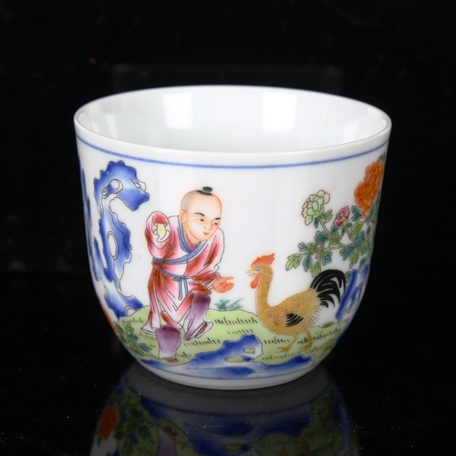 1310 - A small Chinese porcelain bowl, with painted design of a child with a cockerel and panel of text, se... 