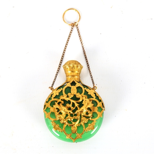 1319 - A 19th century French green glass and unmarked gold overlay perfume flask, with relief cast lovebird... 