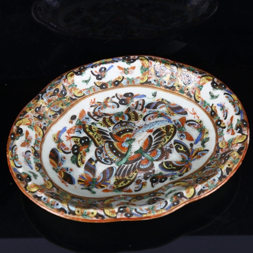 1324 - A Chinese porcelain bowl decorated with gilded and enamelled butterflies, width 26cm