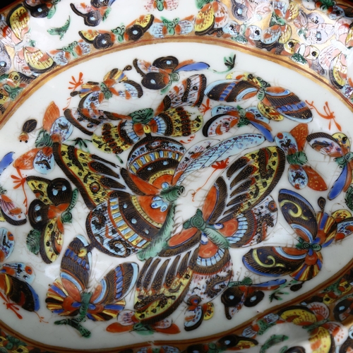 1324 - A Chinese porcelain bowl decorated with gilded and enamelled butterflies, width 26cm