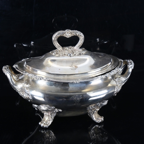 1326 - A large silver plated 2-handled soup tureen and cover, with cast foliate decoration on scrolled acan... 