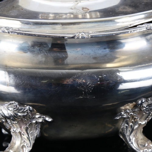 1326 - A large silver plated 2-handled soup tureen and cover, with cast foliate decoration on scrolled acan... 