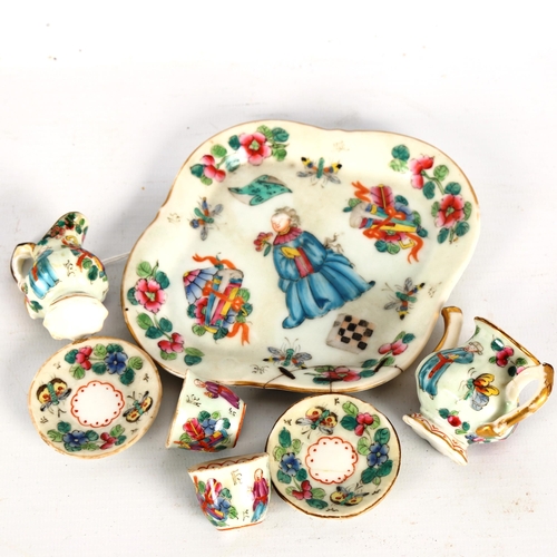 1328 - A Chinese famille rose porcelain doll's tea service on matching tray, tray length 14cm