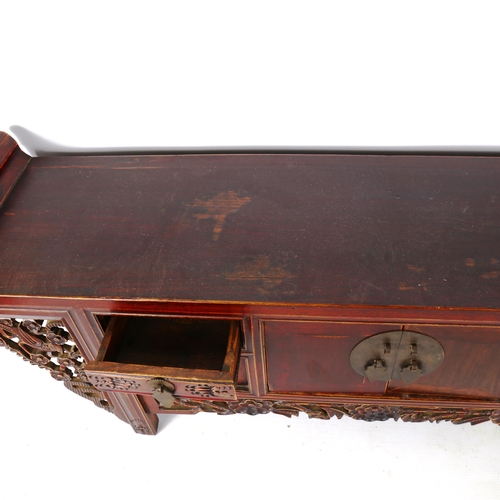 1329 - A Chinese stained wood altar table of small size, with 4 small carved drawers and central cupboard f... 