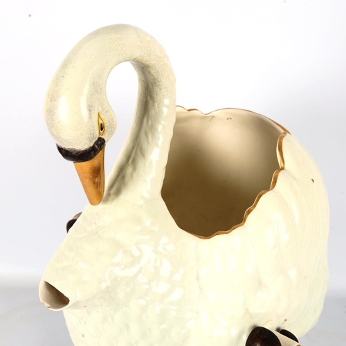 1332 - A 19th century ceramic swan design cistern or punch server, on original gilded cast-iron acanthus sc... 