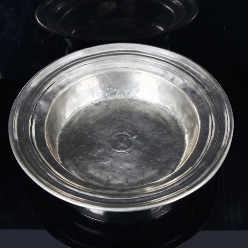 1334 - A pewter bowl with touch marks, diameter 26cm