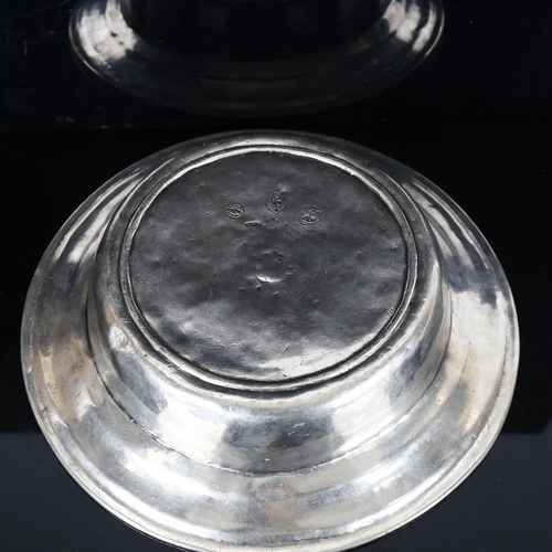 1334 - A pewter bowl with touch marks, diameter 26cm