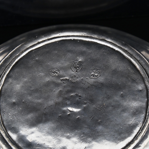 1334 - A pewter bowl with touch marks, diameter 26cm