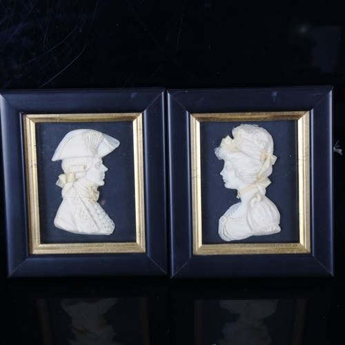 1335 - Leslie Ray, a pair of wax relief portraits in ebonised and gilded frames, overall frame dimensions 1... 