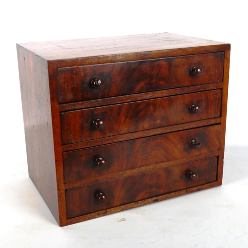 1342 - A 19th century mahogany double-sided table-top collector's chest of 4 drawers, each drawer opening t... 