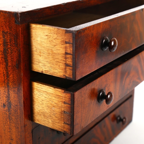 1342 - A 19th century mahogany double-sided table-top collector's chest of 4 drawers, each drawer opening t... 