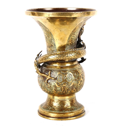 1348 - A Chinese polished bronze vase, with dragon entwined neck and relief decoration, height 21cm, rim di... 