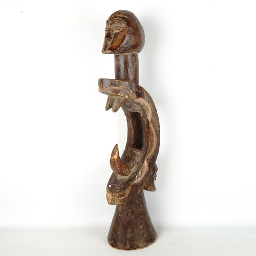 1362 - An African carved and stained wood stylised figure, height 71cm