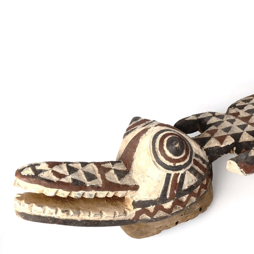 1363 - An African Tribal carved and painted wood crocodile mask, length 116cm