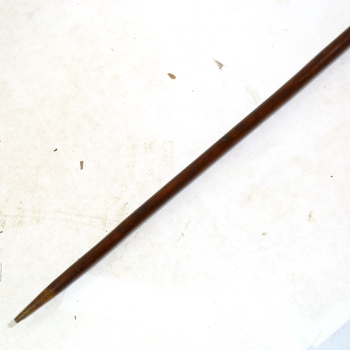 1366 - An African wood and iron double-ended spear with leather-edge blade, length 273cm