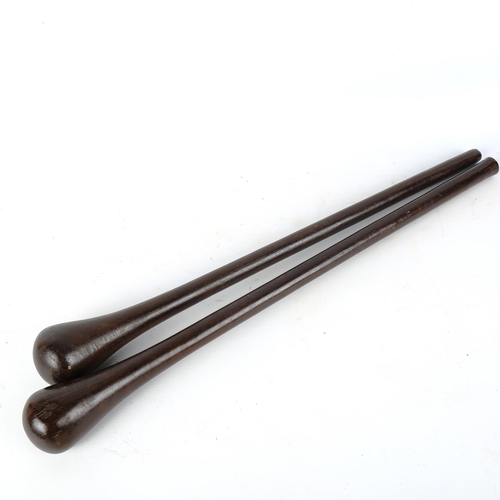 1369 - 2 African blackwood clubs, largest 58cm