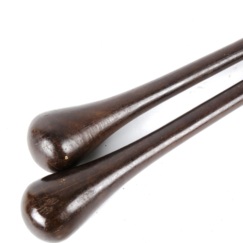 1369 - 2 African blackwood clubs, largest 58cm