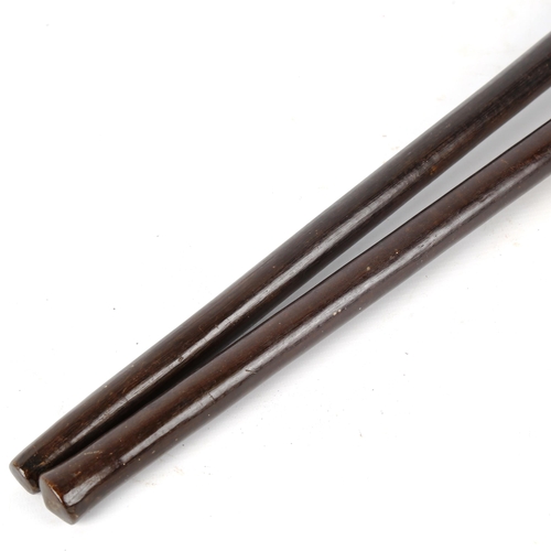 1369 - 2 African blackwood clubs, largest 58cm