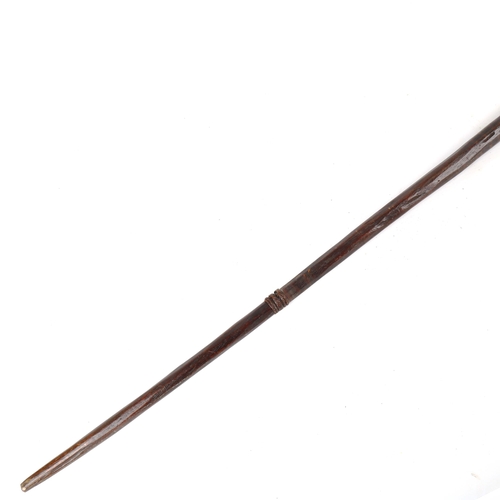 1372 - A Samoan hardwood spear, carved with rows of barbs, first half 19th century, length 210cm