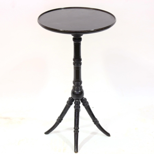 1376 - A Victorian Aesthetic Movement circular ebonised wine table, with turned column and ring turned spla... 