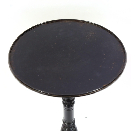 1376 - A Victorian Aesthetic Movement circular ebonised wine table, with turned column and ring turned spla... 