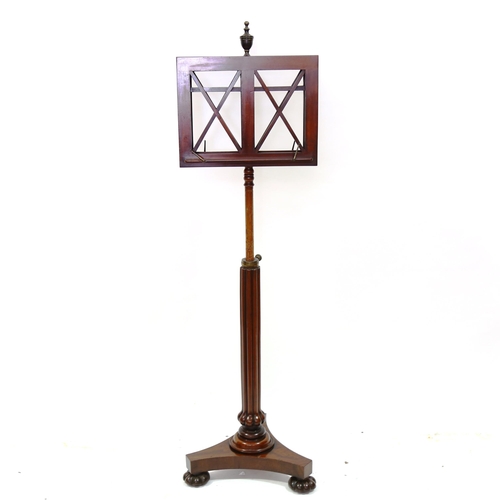 1377 - A William IV mahogany duet music stand, with brass urn finial, bulbous reeded centre column and shap... 