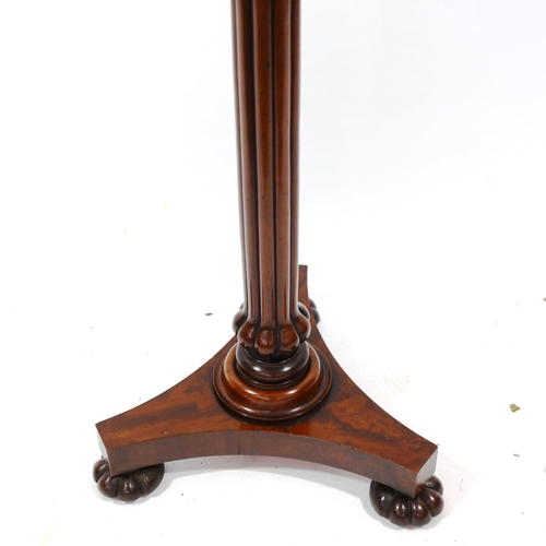 1377 - A William IV mahogany duet music stand, with brass urn finial, bulbous reeded centre column and shap... 