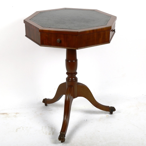 1379 - A Regency octagonal walnut occasional table with inset leather top, 2 frieze drawers and tripod base... 