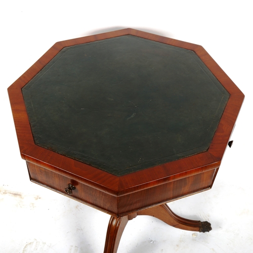 1379 - A Regency octagonal walnut occasional table with inset leather top, 2 frieze drawers and tripod base... 