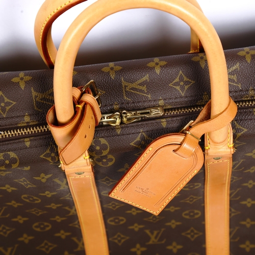 1382 - LOUIS VUITTON - a Monogram travelling case, with tan leather straps and handles, length approx 54cm,... 