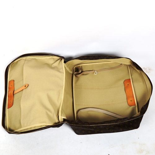 1382 - LOUIS VUITTON - a Monogram travelling case, with tan leather straps and handles, length approx 54cm,... 