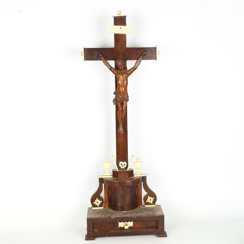 1409 - An 18th century stained wood and bone crucifix, with drawer fitted base, height 73cm