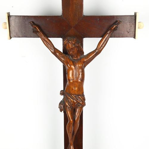 1409 - An 18th century stained wood and bone crucifix, with drawer fitted base, height 73cm