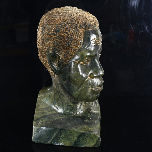 1427 - An African carved soapstone life-size head of a man, unsigned, height 36cm