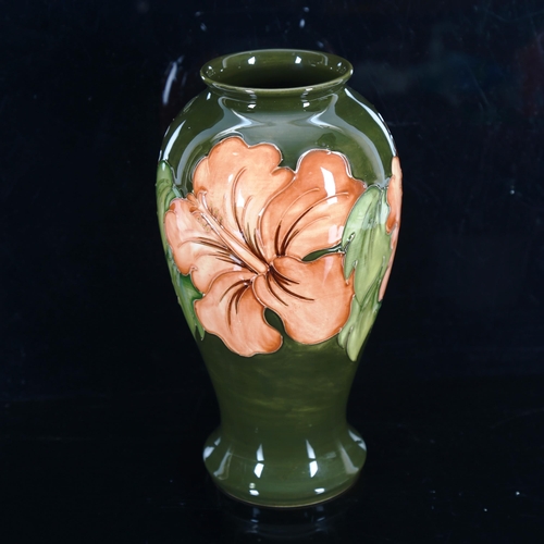 1430 - MOORCROFT POTTERY - a coral Hibiscus pattern vase, height 26cm